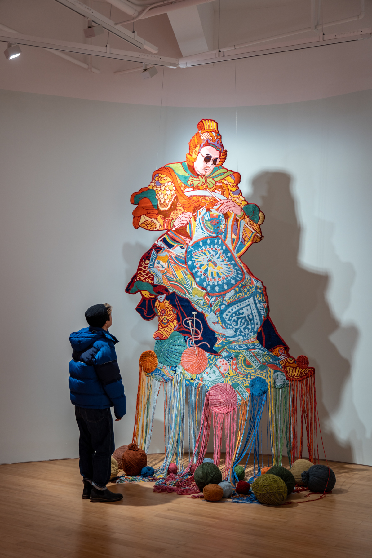 A young visitor beside The Lonely Knitter in Chengdu