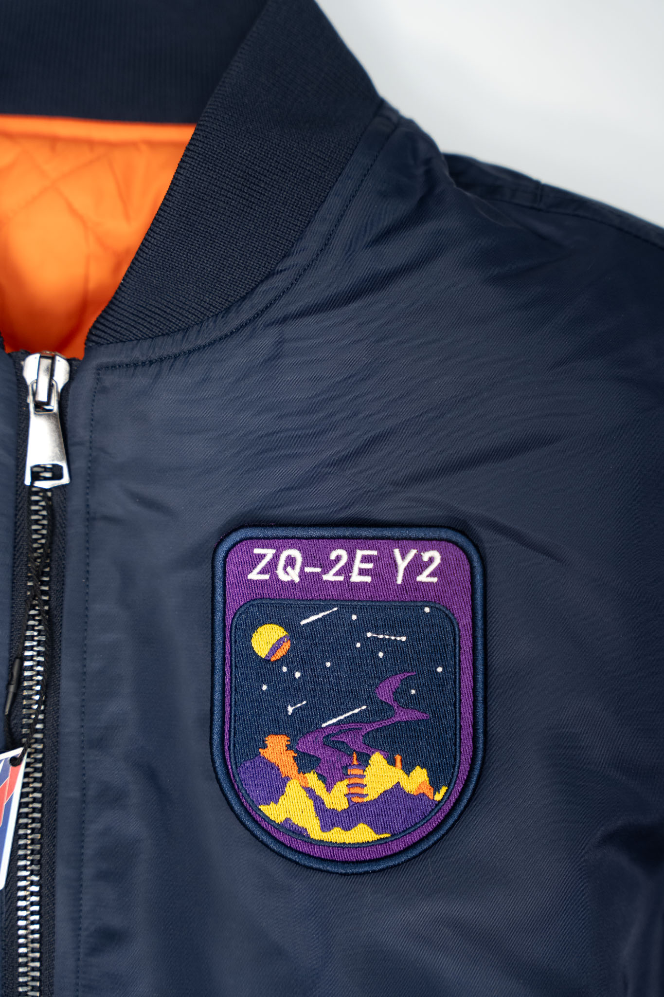 Detail of the LANDSPACE rocket mission patch on the jacket
