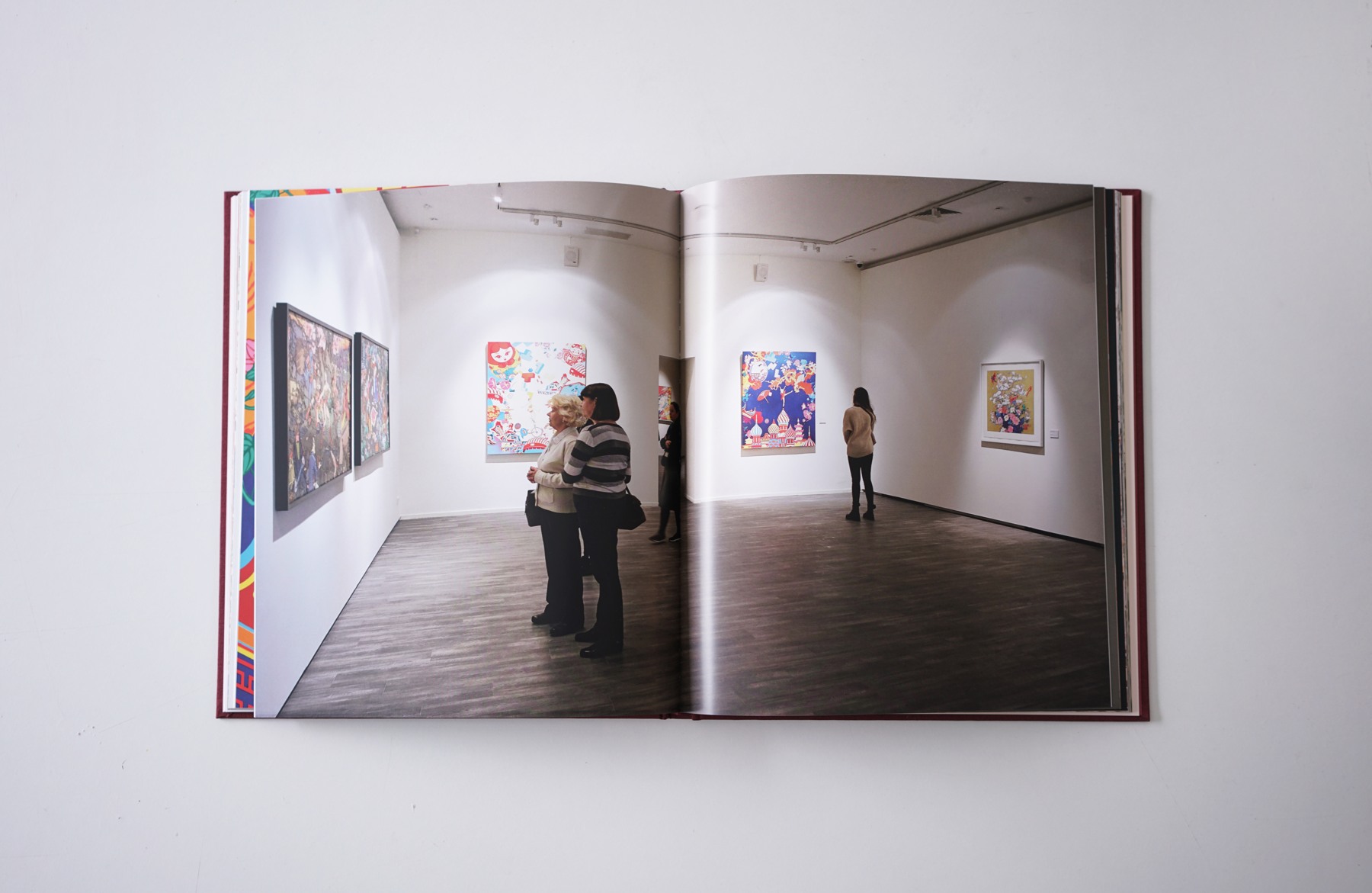 The MMOMA exhibition documented across a double-page spread.
